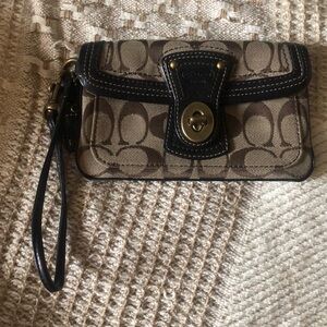 Coach wristlet, 7 inches by 4 1/4 Inches, brown and tan